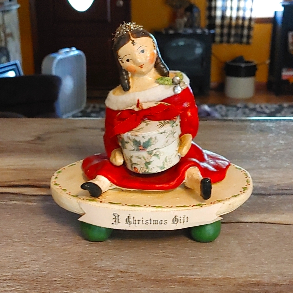 Nicol Sayre Retired Victorian Style Doll holding gift box.